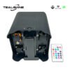 A black IP65 Powerful Wireless Battery Powered Uplighter stage light from TEALSHINE, featuring multiple ports and a handle, is displayed next to a color remote control. Various logos highlight its IP65 rating, wireless DMX functionality, and charging capability.