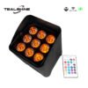 Black LED stage light with nine orange-glowing bulbs paired with a rectangular remote control equipped with multicolored buttons. Corner logos display TEALSHINE, IP65, Wireless DMX, and a charging icon—highlighting the IP65 Powerful Wireless Battery Powered Uplighter, ideal for dynamic lighting environments.