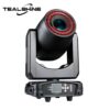 Introducing the IP20 200W Module LED Moving Head Spot Light with Dual Ring Effect—a sleek black stage light featuring a striking red ring around the lens, an intuitive control panel and display at the base, and the TEALSHINE logo in the top left corner. Ideal for those seeking powerful moving head spot lights to create vibrant stage effects.