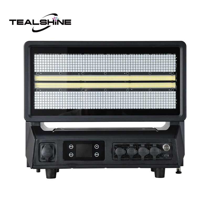 LED Strobe Lights: How to Choose the Right Strobe for Stage, DJ, and Event Lighting 2 A black electronic device labeled TEALSHINE, featuring a rectangular grill, control knobs, buttons, and a display screen on its front panel—likely an amplifier or heater—sits beside an IP65 Mini 1176 Moving Strobe Light that adds dynamic illumination to its surroundings.
